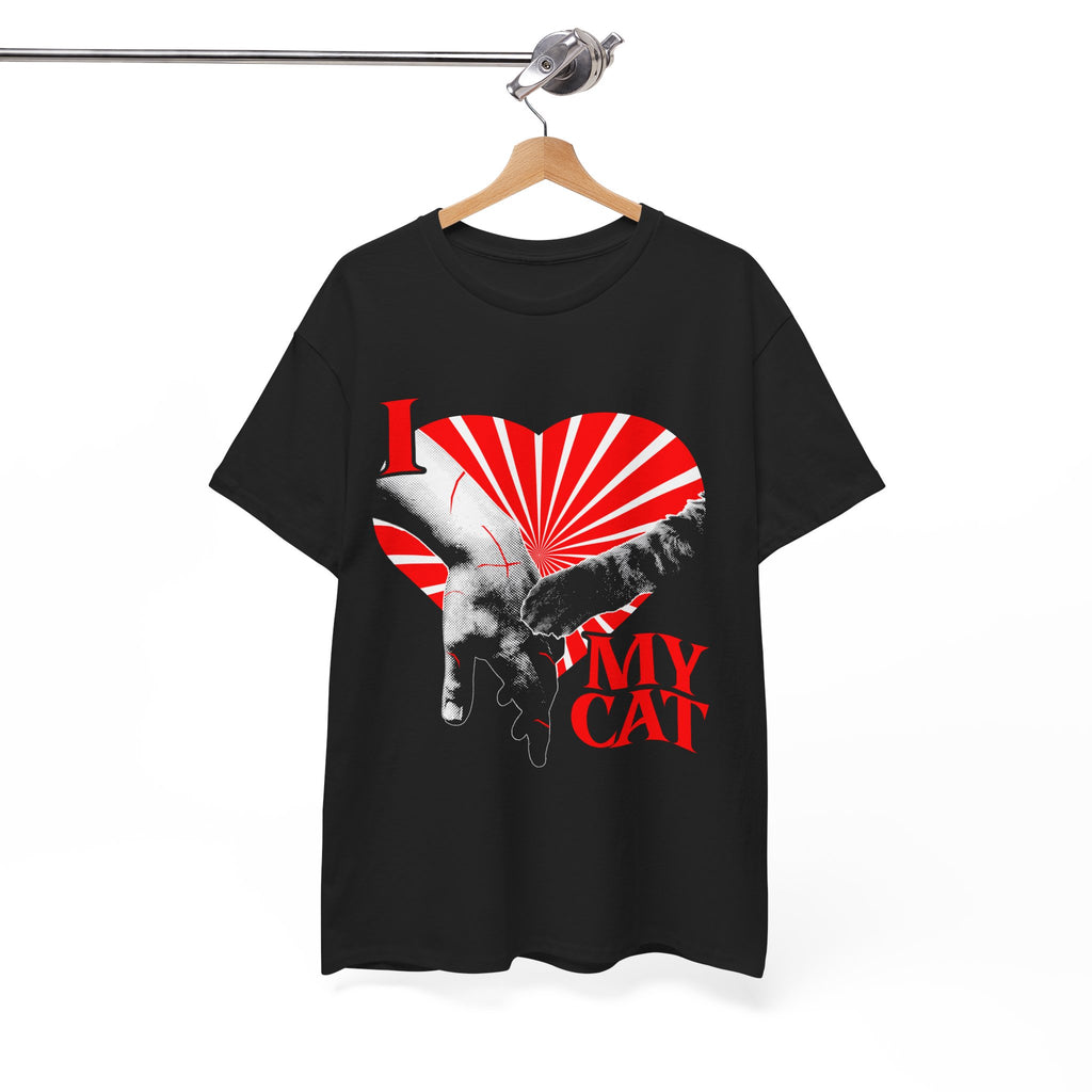 A hanging graphic tee displaying a funny classical art parody of a scratch-marked human hand and a cat paw over a red heart, reading 'I MY LOVE CAT' in a bold vintage font.