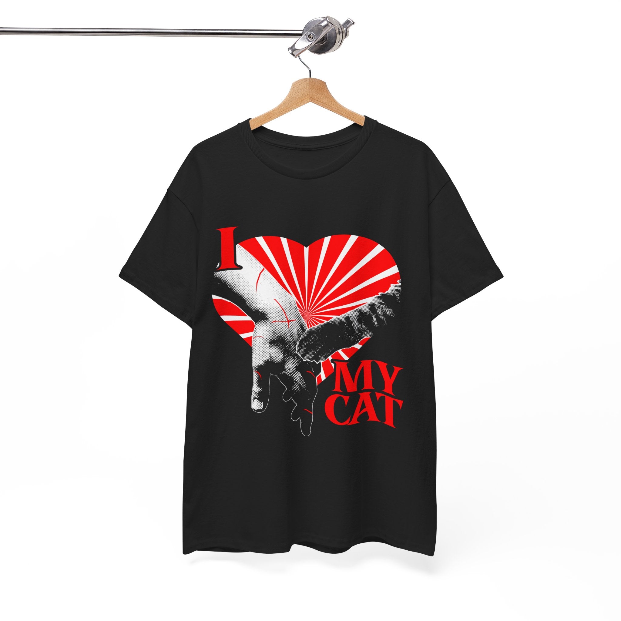 A hanging graphic tee displaying a funny classical art parody of a scratch-marked human hand and a cat paw over a red heart, reading 'I MY LOVE CAT' in a bold vintage font.