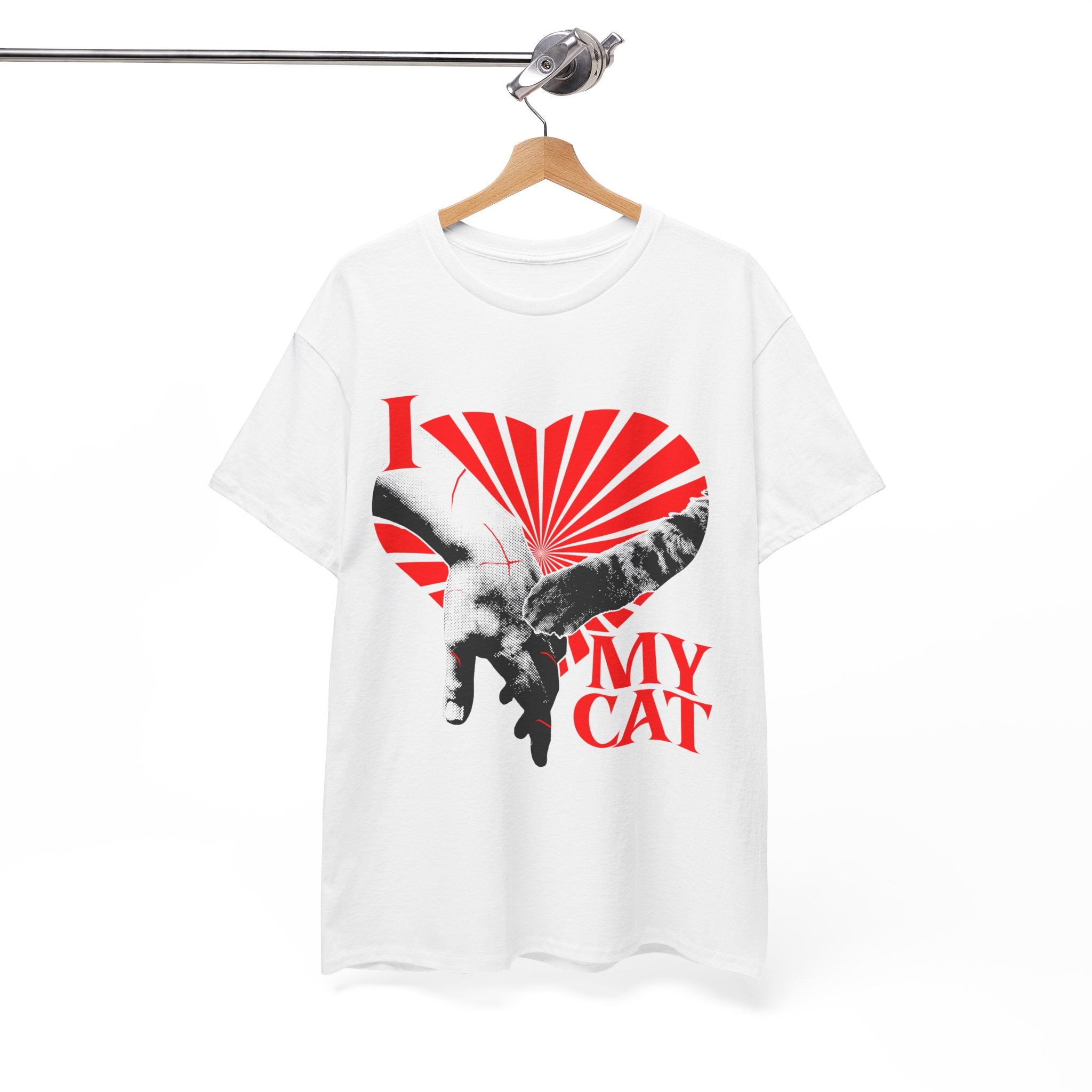 A hanging graphic tee displaying a funny classical art parody of a scratch-marked human hand and a cat paw over a red heart, reading 'I MY LOVE CAT' in a bold vintage font.